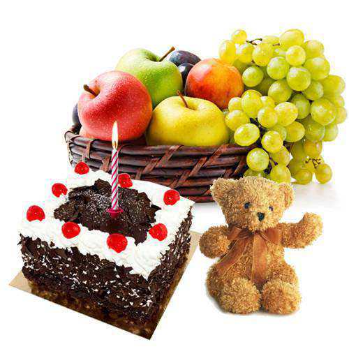 Exclusive Teddy with Candles Fresh Fruits Basket and Black Forest Cake