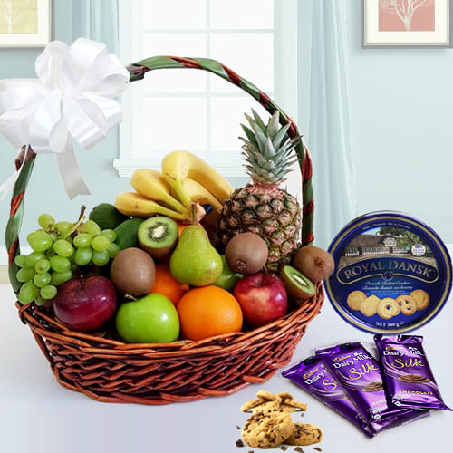 Enticing Fresh Fruits Basket with Danish Cookies N Chocolates