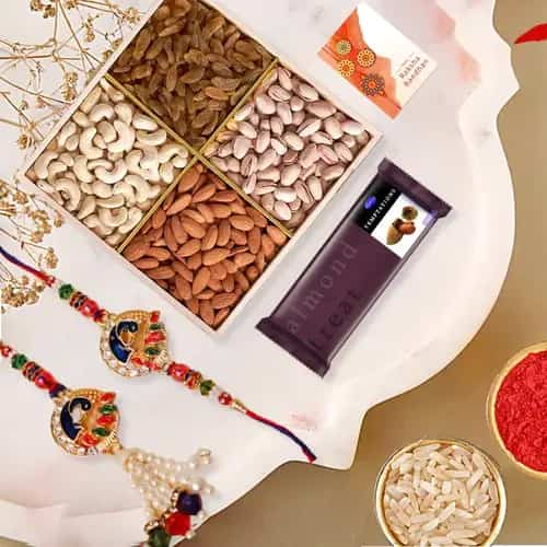 Classy Bhaiya Bhabhi Rakhi Set with Dry Fruits n  Cadbury Temptations